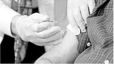 A resident at a nursing home in New York gets vaccinated for COVID-19. SETH HARRISON/THE JOURNAL NEWS